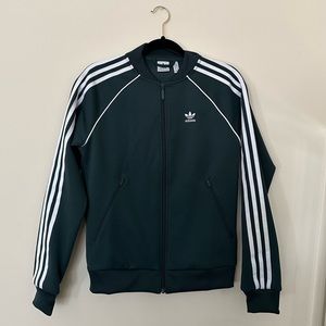 Adidas Originals adicolor three stripe track top in dark green